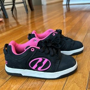 I’m selling youth 3 sized pink and black heelys for a little girl/boy